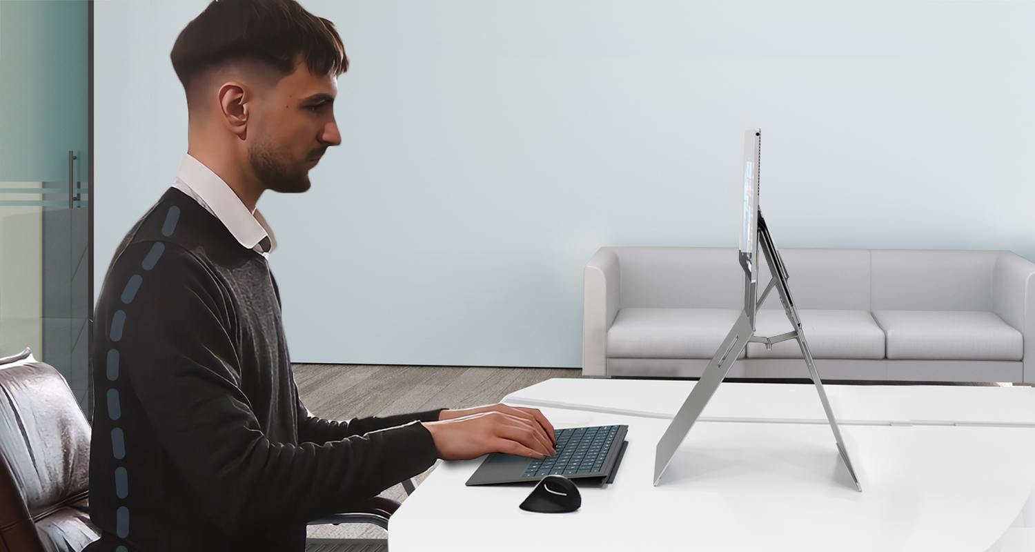 A professional using Microsoft Surface Pro with KickStand, raising the screen on an ergonomic position, demonstrating good posture.