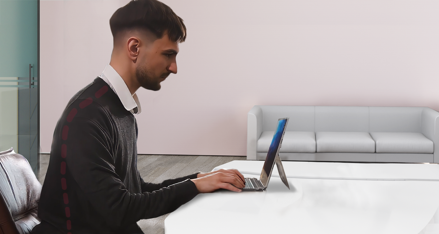 a professional working using Microsoft Surface Pro without ergonomic tools, showing bad posture