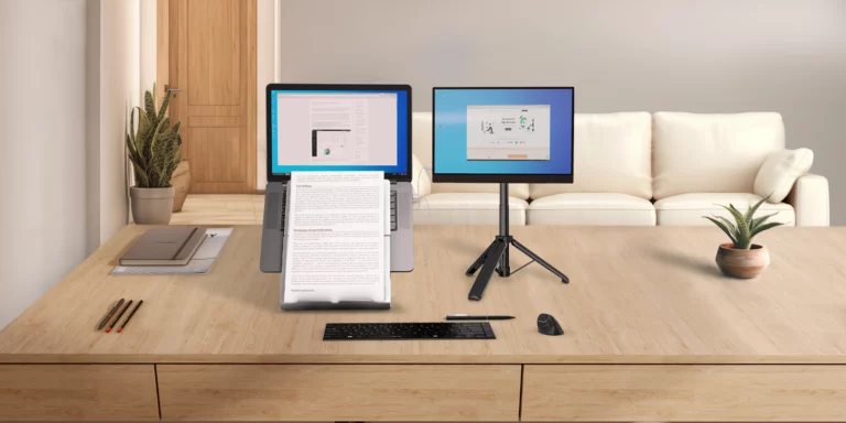 A clean, clutter-free workspace featuring ergonomic tools such as Standivarius Oryx evo D laptop stand and X-Stand for portable monitor, designed for comfort and productivity.